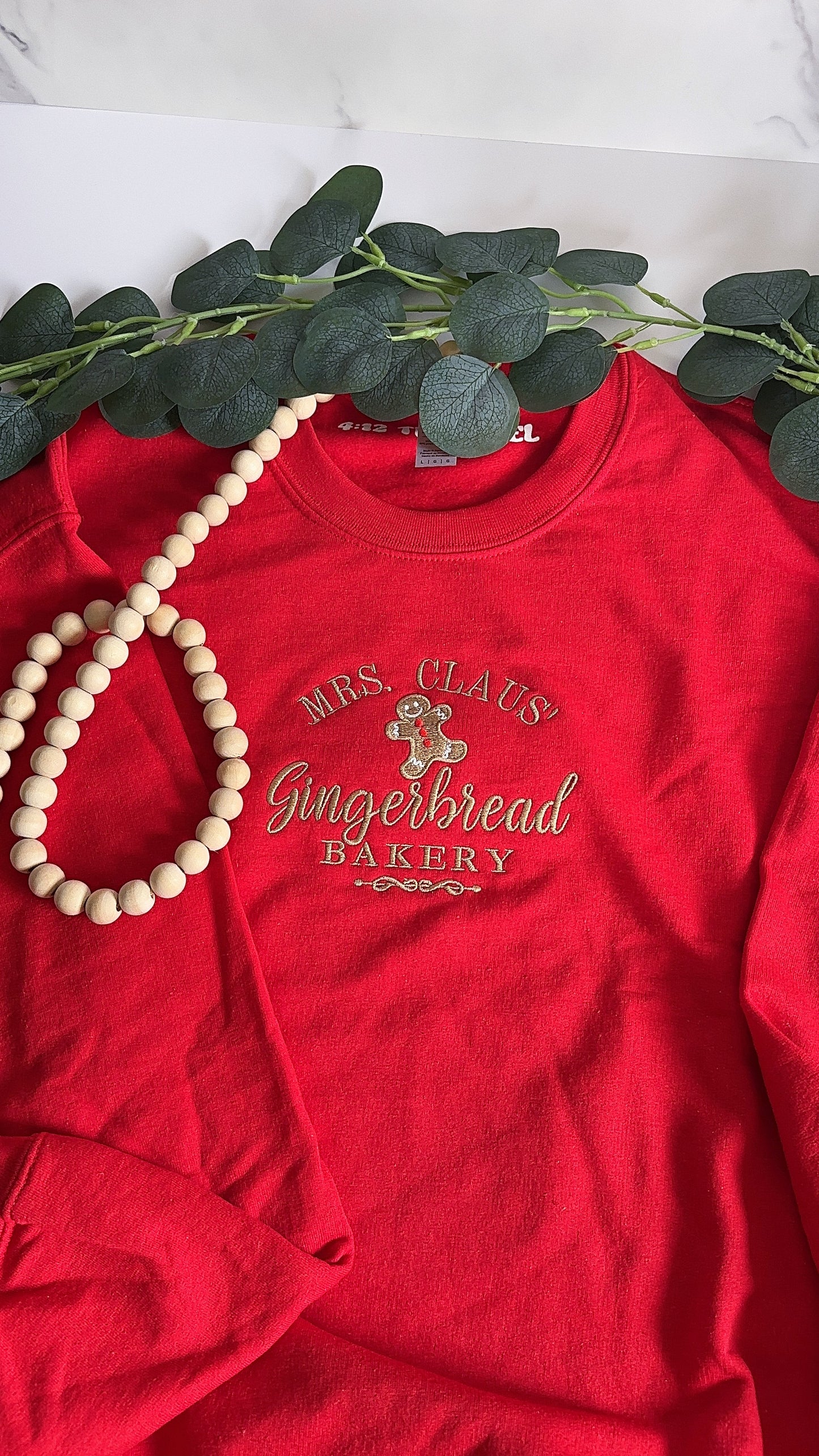 Mrs. Claus' Gingerbread Bakery Embroidered Sweatshirt
